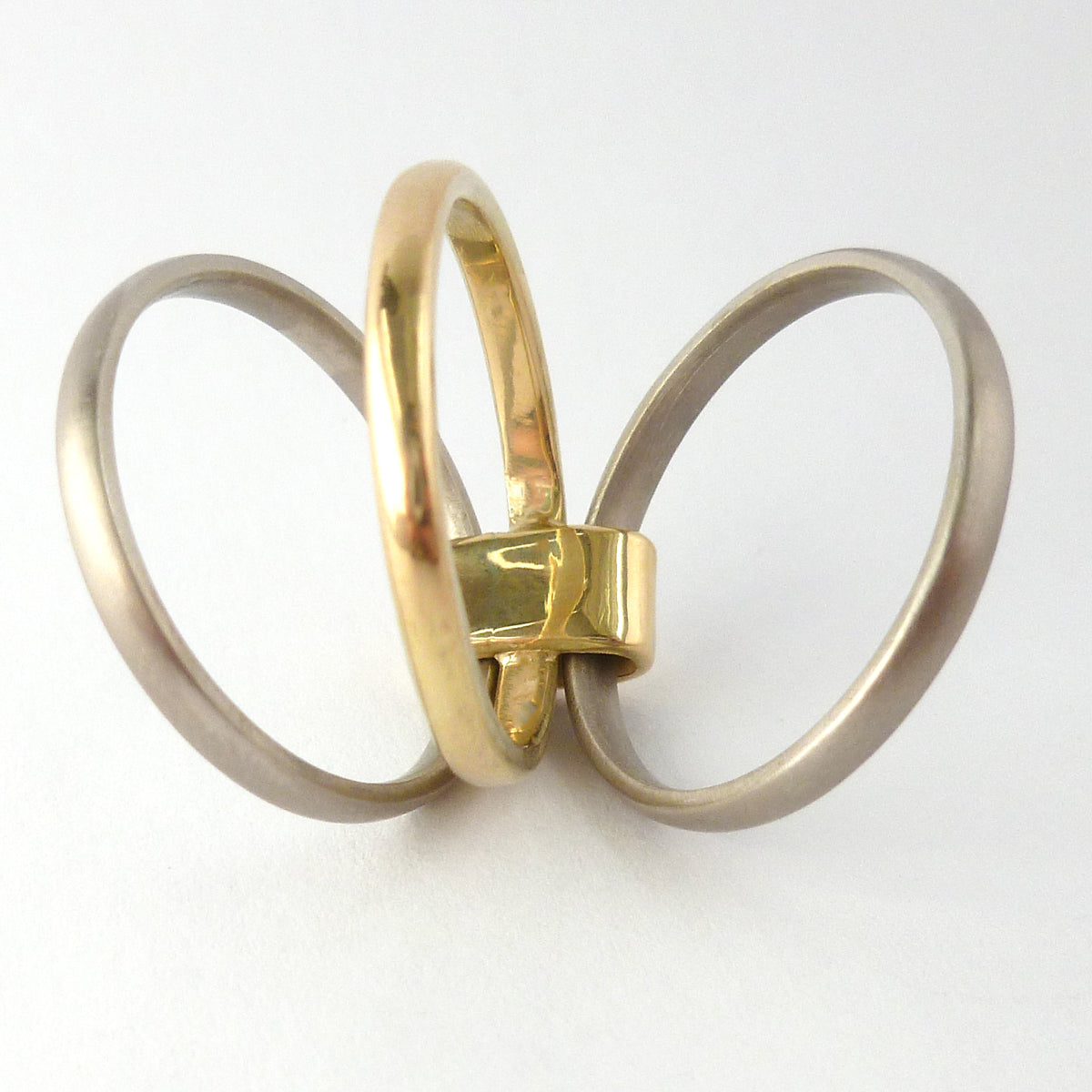 Contemporary jewellery, handmade, modern, bespoke ring by Sue Lane. Triple band ring, interlocking and linked.