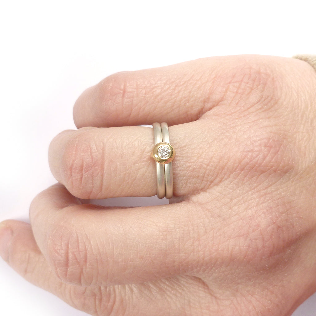 Contemporary modern yellow gold, silver diamond engagement ring, dress ring, eternity ring. Multi band ring or interlocking ring, sometimes called double band ring too.