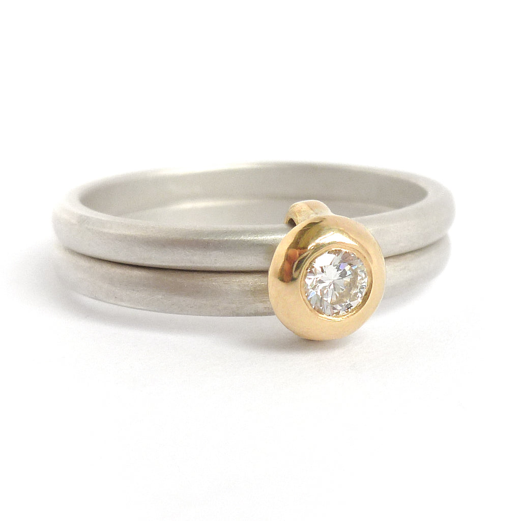Contemporary modern yellow gold, silver diamond engagement ring, dress ring, eternity ring. Multi band ring or interlocking ring, sometimes called double band ring too.