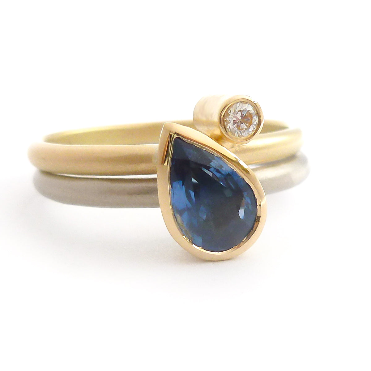 Modern cornflower blue ethically sourced sapphire and diamond stacking ring set by Sue Lane. Multi band ring or interlocking ring, sometimes called double band ring too.