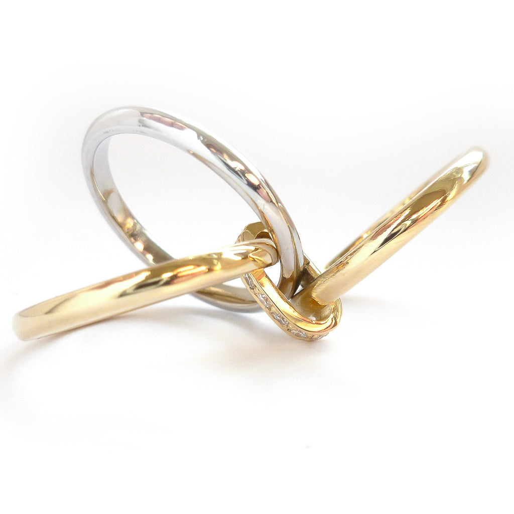 Three band gold and platinum ring with diamonds. Bespoke, contemporary and unique. Multi band ring or interlocking ring, sometimes called triple band rings too.
