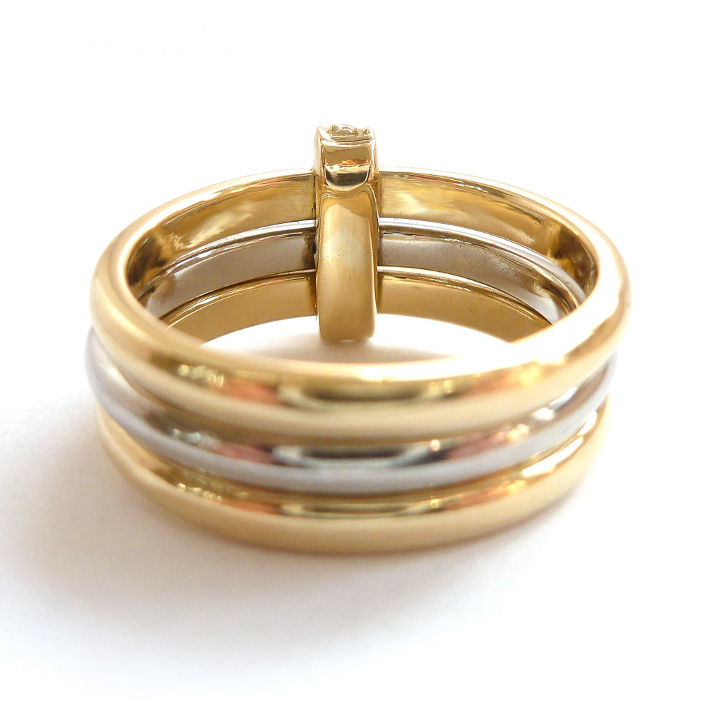 Three band gold and platinum ring with diamonds. Bespoke, contemporary and unique. Multi band ring or interlocking ring, sometimes called triple band rings too.