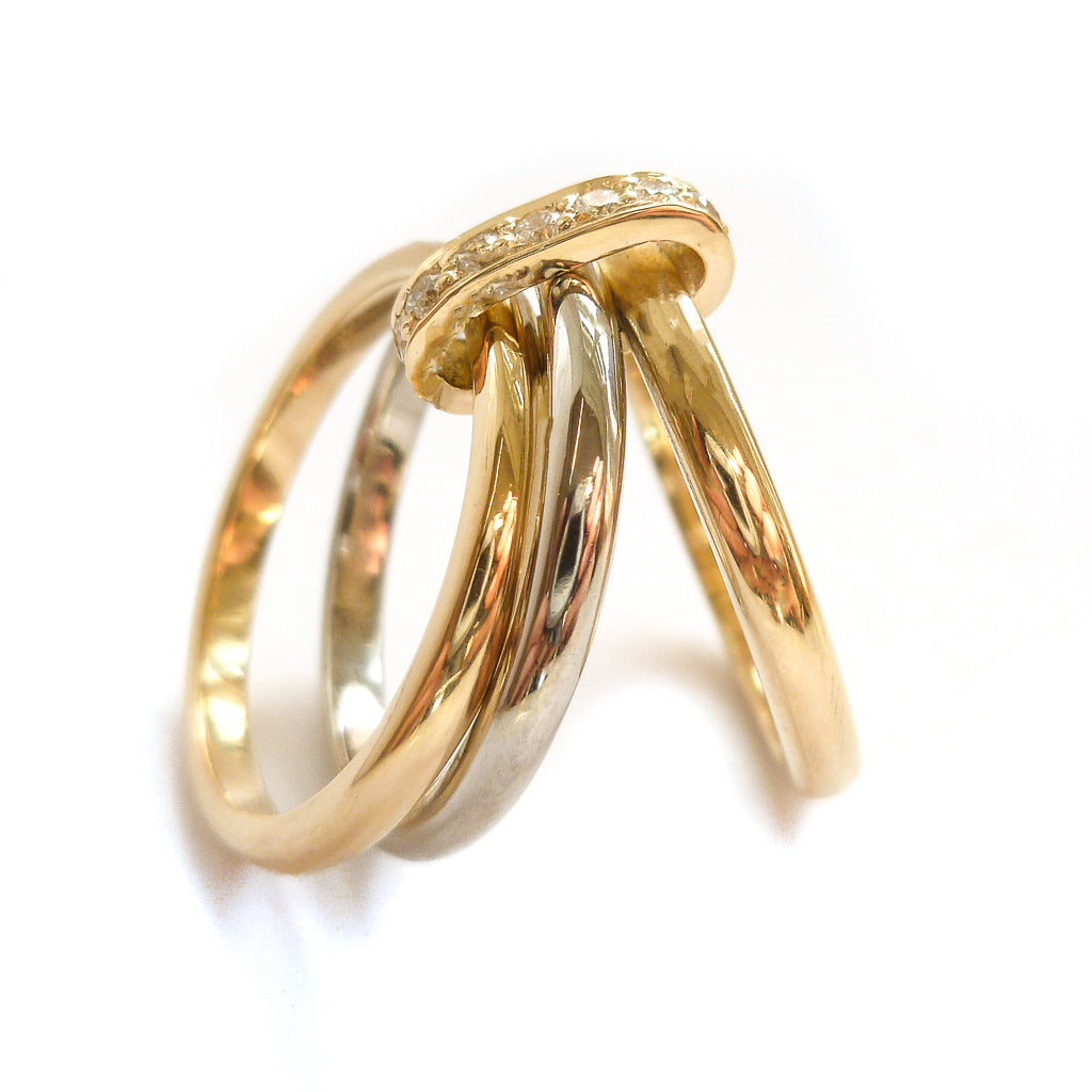 Three band gold and platinum ring with diamonds. Bespoke, contemporary and unique. Multi band ring or interlocking ring, sometimes called triple band rings too.