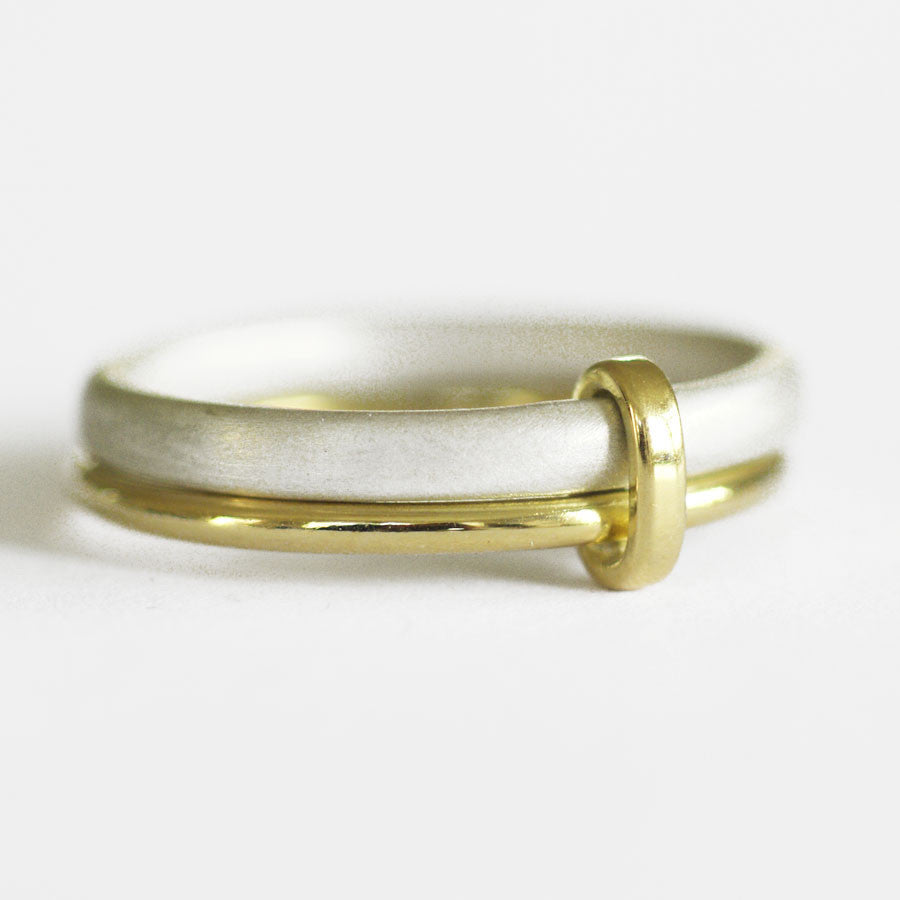 Unusual, unique, bespoke and modern women's/men’s wedding ring in silver and gold. Handmade by Sue Lane Jewellery in Herefordshire, UK. Unique wedding ring.