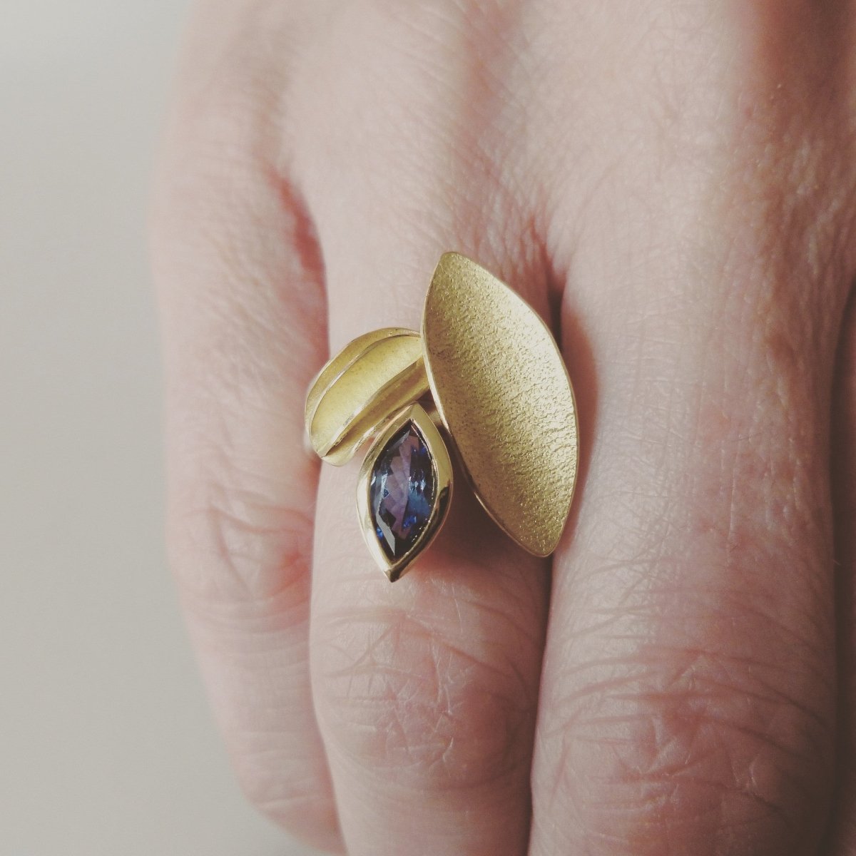 Unique, bespoke and modern statement tanzanite silver and gold stacking ringset handmade by designer Sue Lane contemporary Jewellery, UK