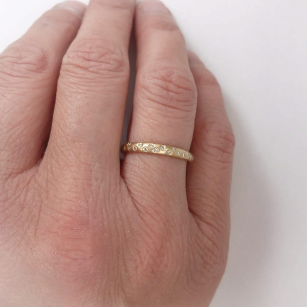 A modern, contemporary gold eternity ring, wedding ring, or engagement ring