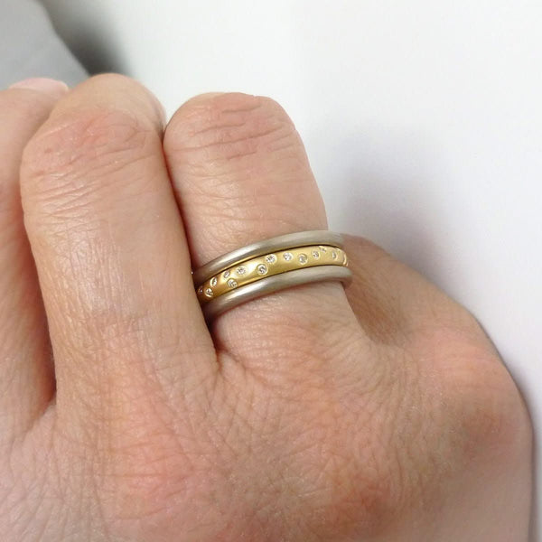 A modern, contemporary gold eternity ring, wedding ring, or engagement ring
