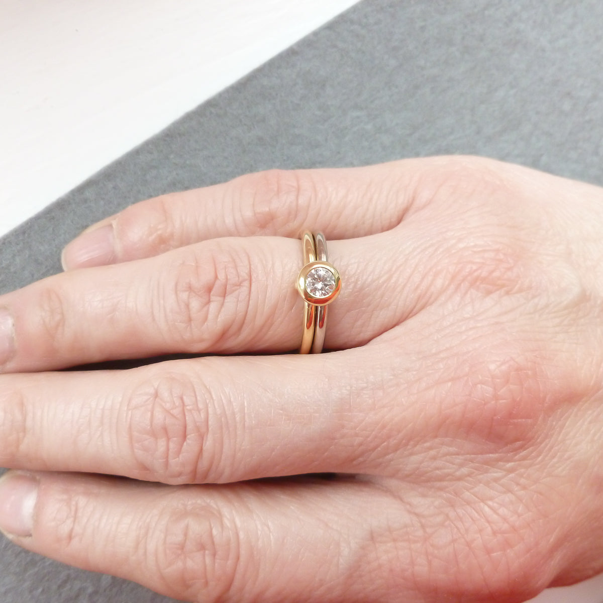 18ct white and yellow gold two band ring with certified diamond
