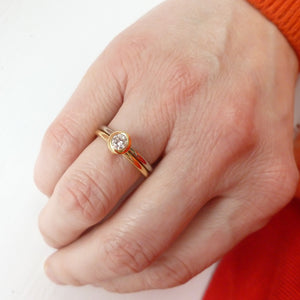 18ct white and yellow gold two band contemporary ring with certified diamond.