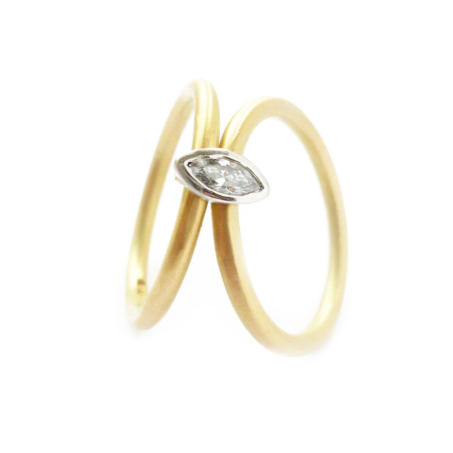 Contemporary, modern and bespoke 18k yellow gold and platinum marquise diamond ring. Handmade stacking ring by Sue Lane Jewellery. A unique engagement ring.