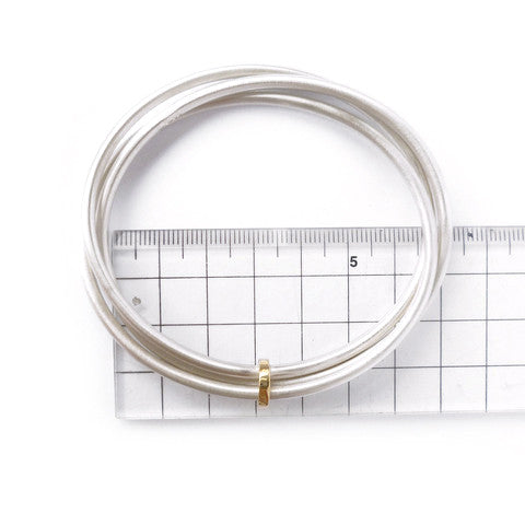 Unusual, unique, bespoke and modern silver and gold Russian style bangle with brushed finish. Handmade by Sue Lane Jewellery in Herefordshire, UK