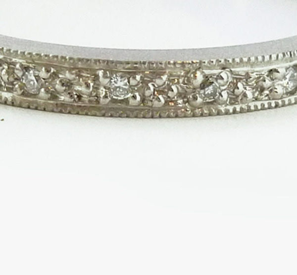 A beautiful classic platinum and diamond wedding or eternity ring handmade by Sue 