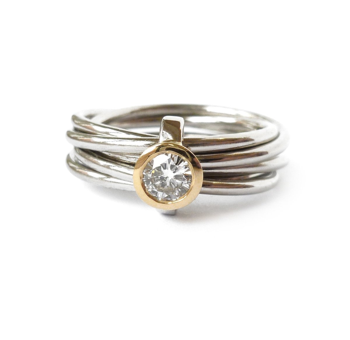 Unusual, unique, bespoke and modern Russian style platinum and diamond wedding ring, contemporary engagement ring, Handmade by Sue Lane in Herefordshire. Multi band ring or interlocking ring.