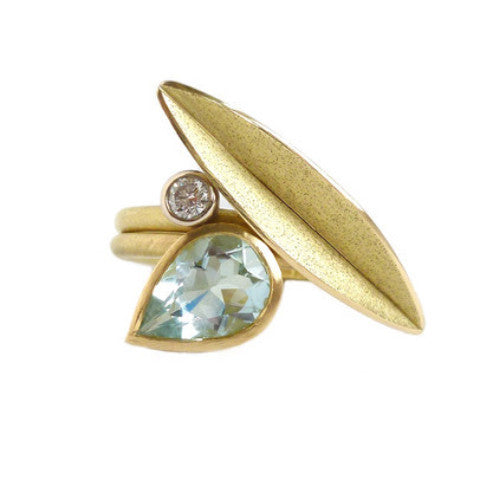Unique, modern and contemporary two band ring, set with a pear shape aquamarine. Dress ring or alternative engagement ring. Handmade designer Sue Lane Jewellery