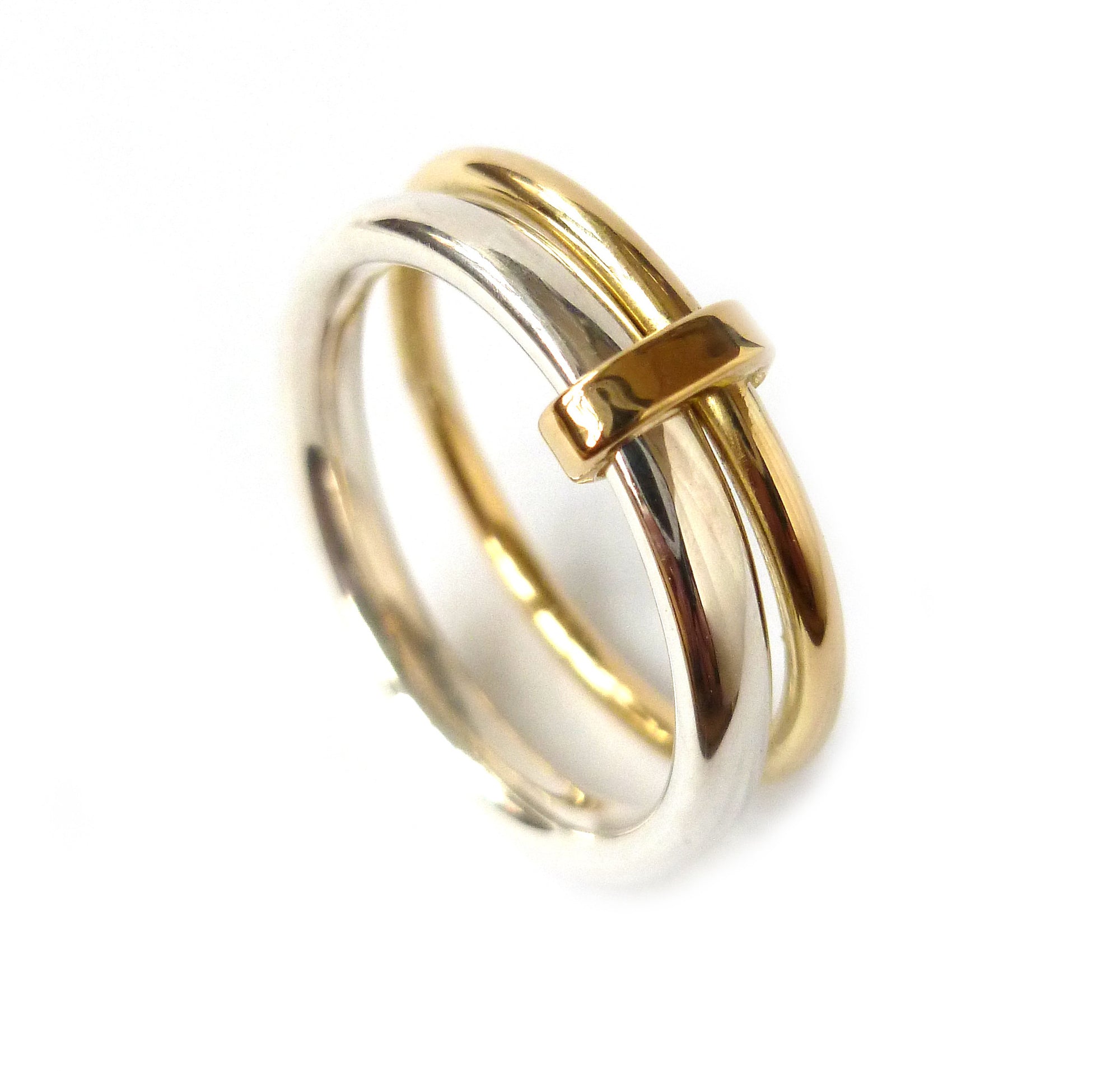 Unusual, unique, bespoke and modern women's/men’s wedding ring in silver and gold. Handmade by Sue Lane Jewellery in Herefordshire, UK. Unique wedding ring.