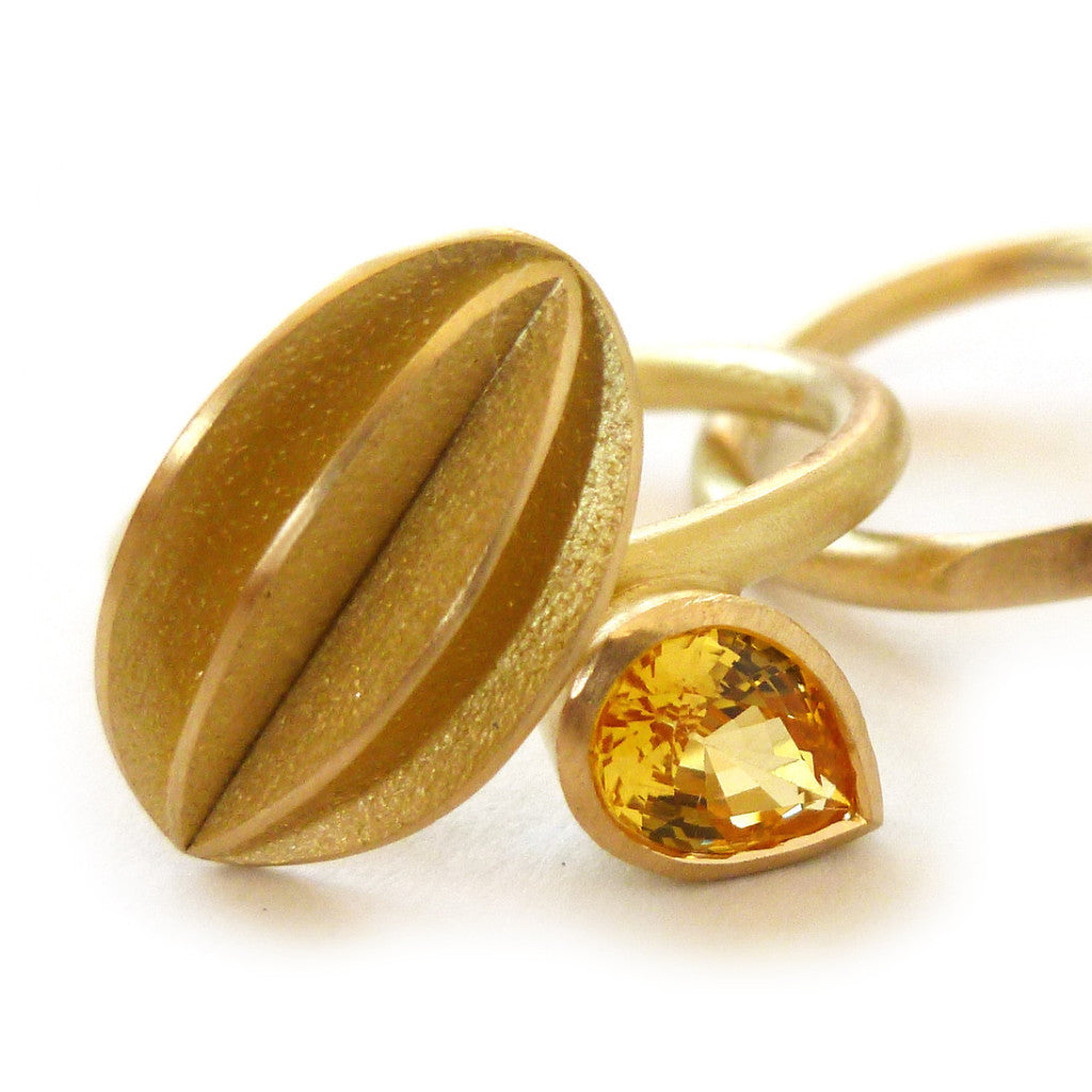Unique, bespoke and modern statement gold and pear shape yellow sapphire and diamond stacking ringset handmade by designer Sue Lane contemporary Jewellery, UK
