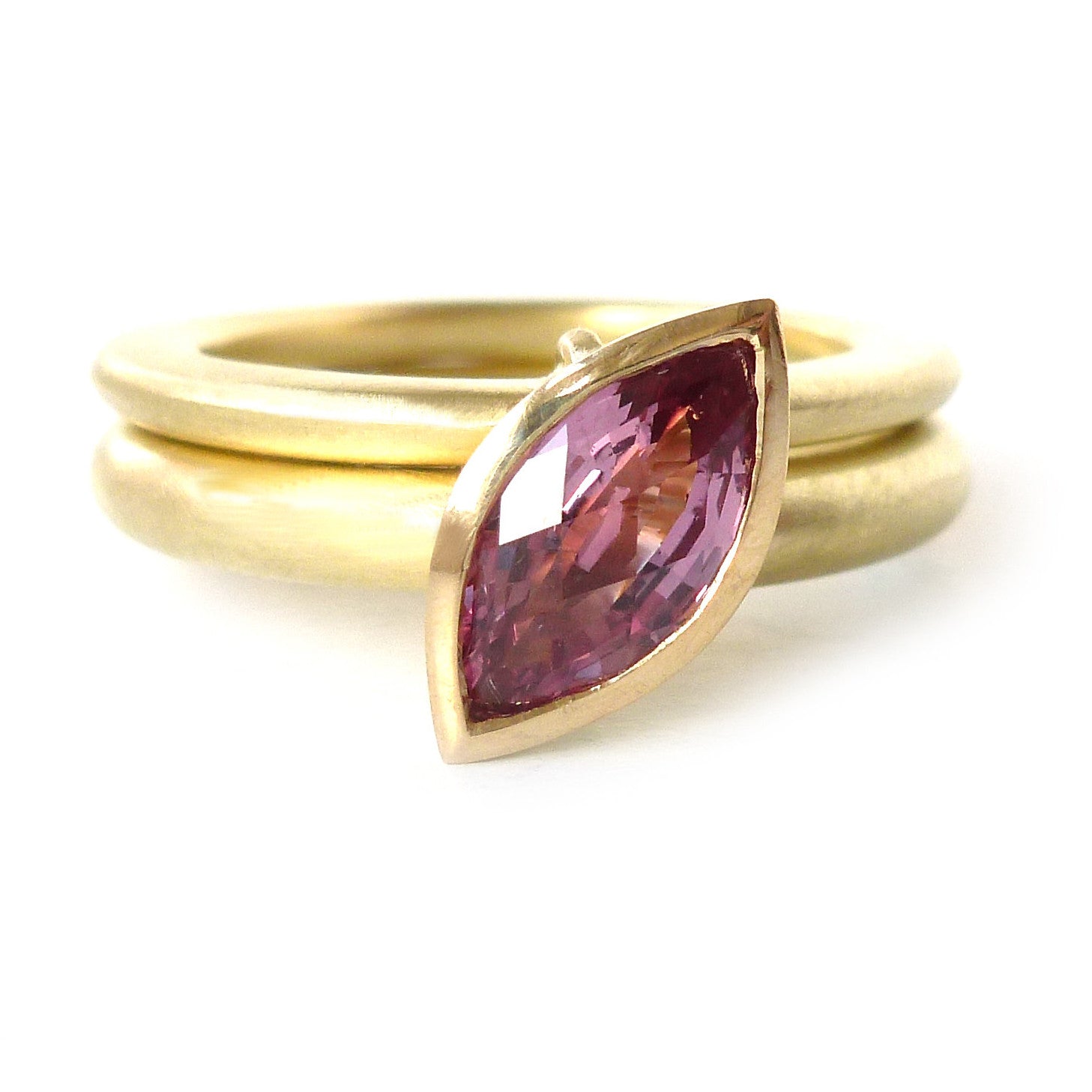 Unusual, unique, bespoke and modern statement gold and marquise pink sapphire stacking ring set handmade by designer maker Sue Lane contemporary Jewellery, UK