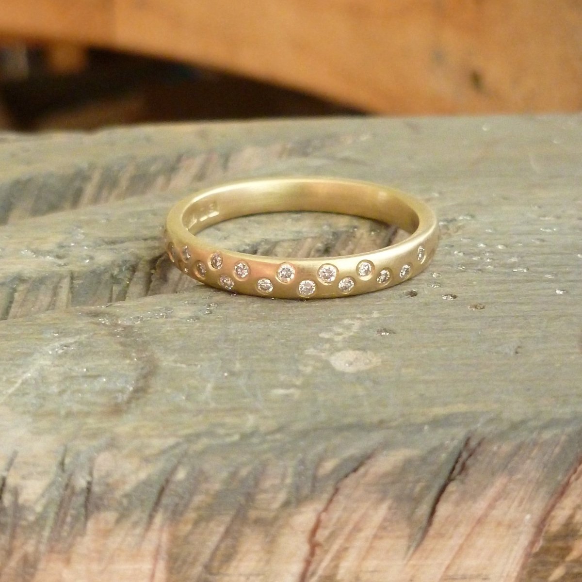 Modern, contemporary and unique handmade gold 12 diamond eternity ring, wedding ring, or engagement ring by Sue Lane Contemporary Jewellery, UK. Made to order.