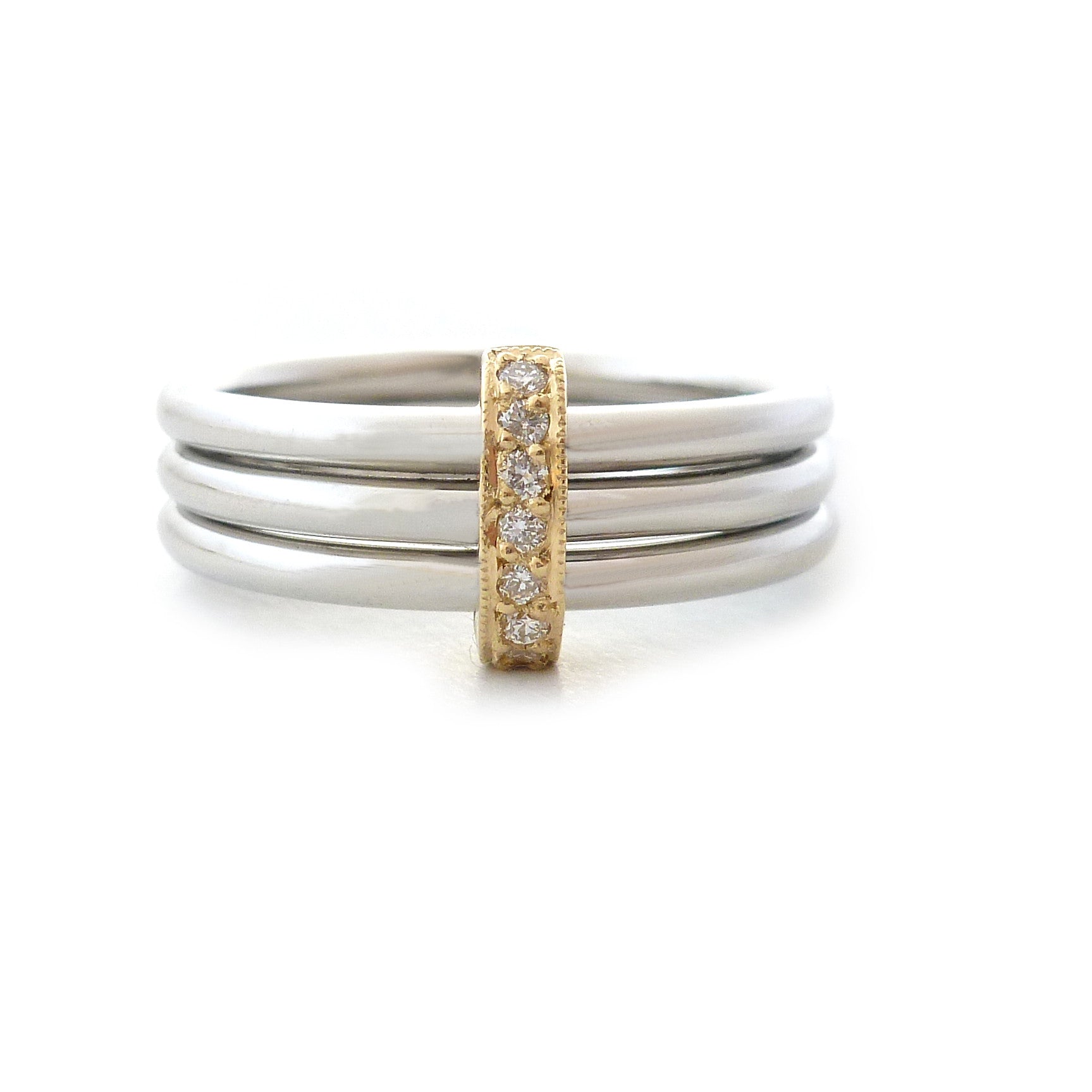 Modern engagement wedding stacking ring in platinum and gold with diamonds. Multi band ring or interlocking ring, sometimes called triple band rings too.