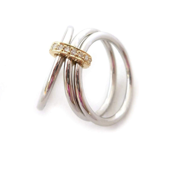 Modern engagement wedding stacking ring in platinum and gold with diamonds. Multi band ring or interlocking ring, sometimes called triple band rings too.
