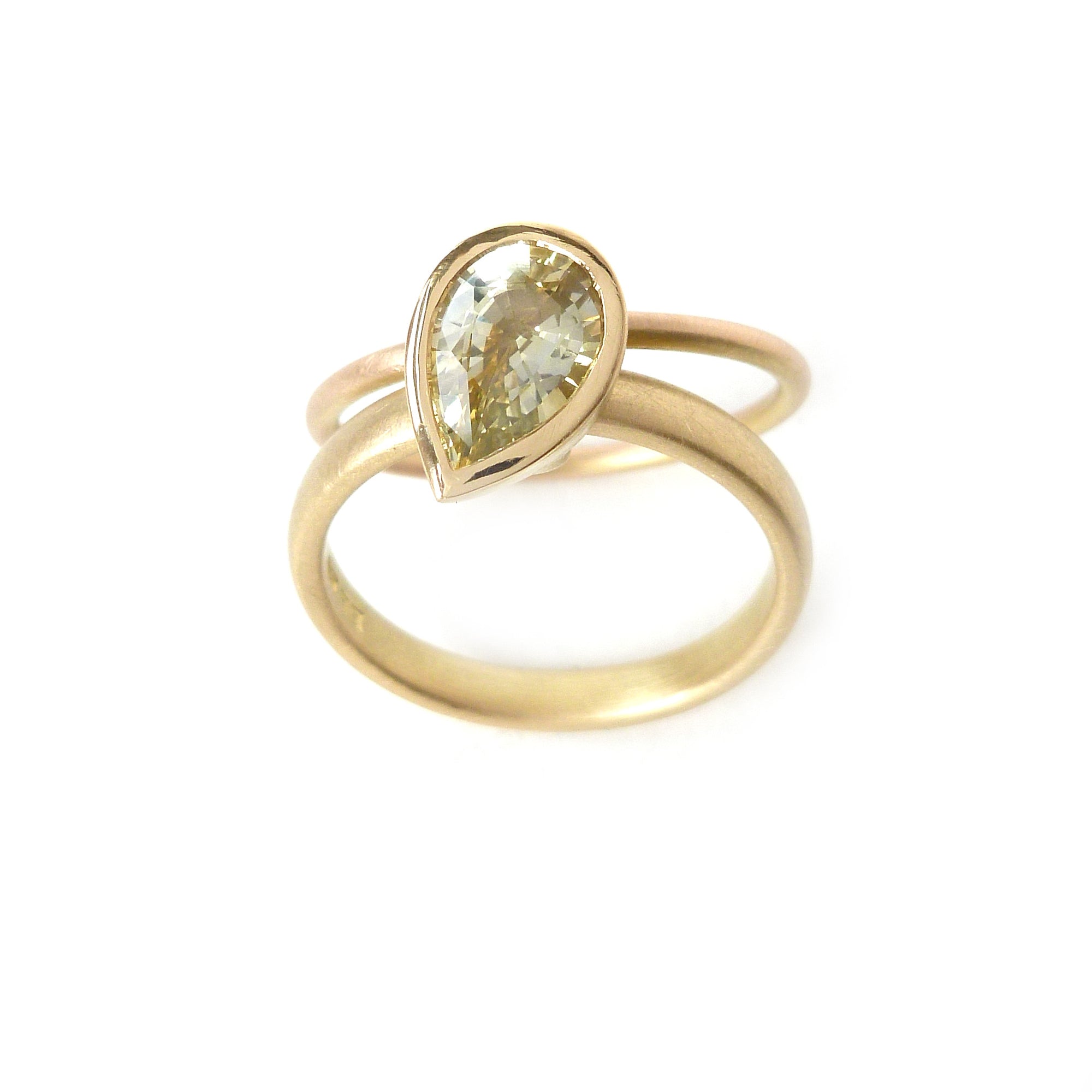 Unique, modern and contemporary ring, set with a beautiful green sapphire. Perfect for a alternative wedding and engagement ring. Handmade in UK by Sue Lane.