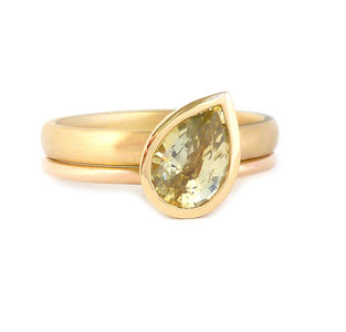 Unique, modern and contemporary ring, set with a beautiful green sapphire. Perfect for a alternative wedding and engagement ring. Handmade in UK by Sue Lane.