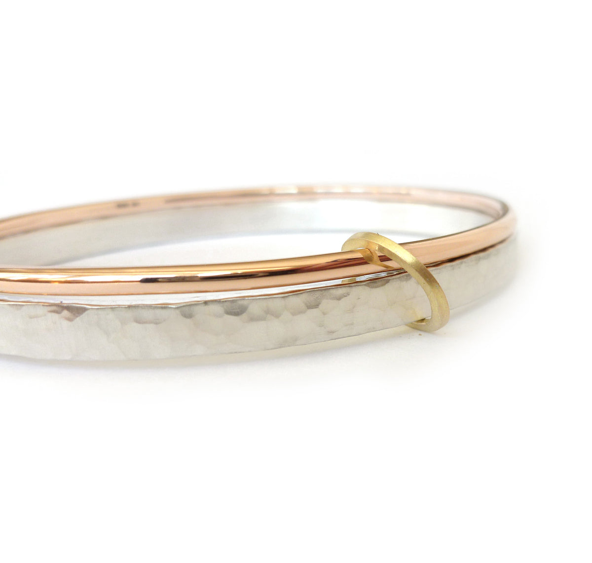 Unusual, unique, bespoke and modern three colour gold and silver bangle with brushed finish. Handmade by Sue Lane Contempoary Jewellery in Herefordshire, UK