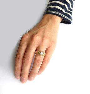 Contemporary, bespoke and modern yellow gold multi band engagement wedding ring, 0.25pt round white diamond, handmade by designer maker sue lane jewellery. Multi band ring or interlocking ring.