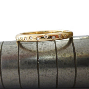 Contemporary and unique handmade gold 10 diamond modern eternity ring, bespoke wedding ring, or engagement ring by Sue Lane Contemporary Jewellery, UK.