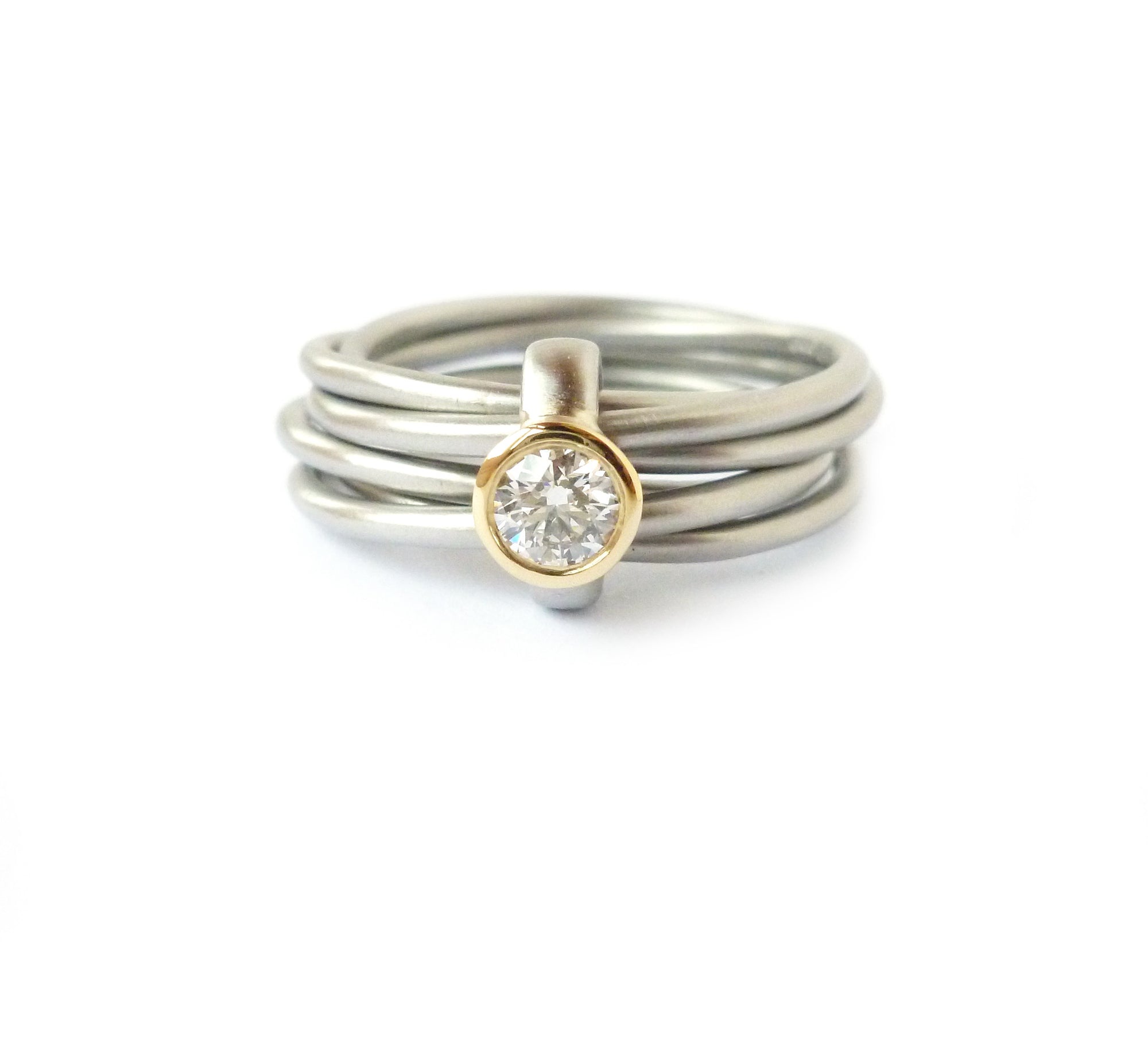 Unusual, unique, bespoke and modern Russian style platinum and diamond wedding ring, contemporary engagement ring, Handmade by Sue Lane in Herefordshire. Multi band ring or interlocking ring.