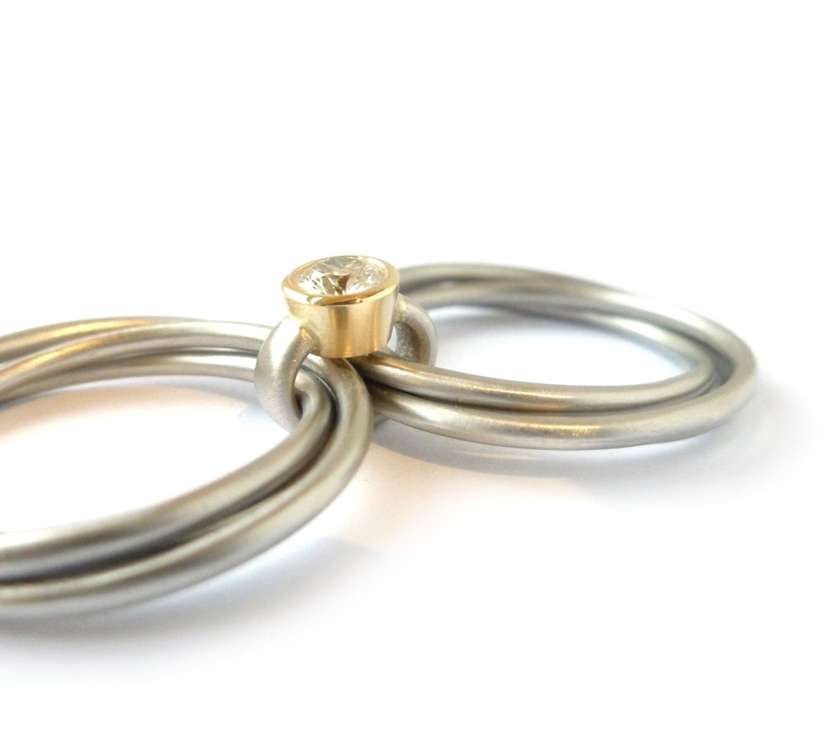 Unusual, unique, bespoke and modern Russian style platinum and diamond wedding ring, contemporary engagement ring, Handmade by Sue Lane in Herefordshire. Multi band ring or interlocking ring.