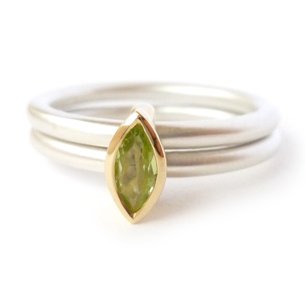 Unusual, unique, bespoke and modern two band stacking ring in silver and yellow gold with green marquise peridot Handmade by Sue Lane Contemporary Jewellery UK