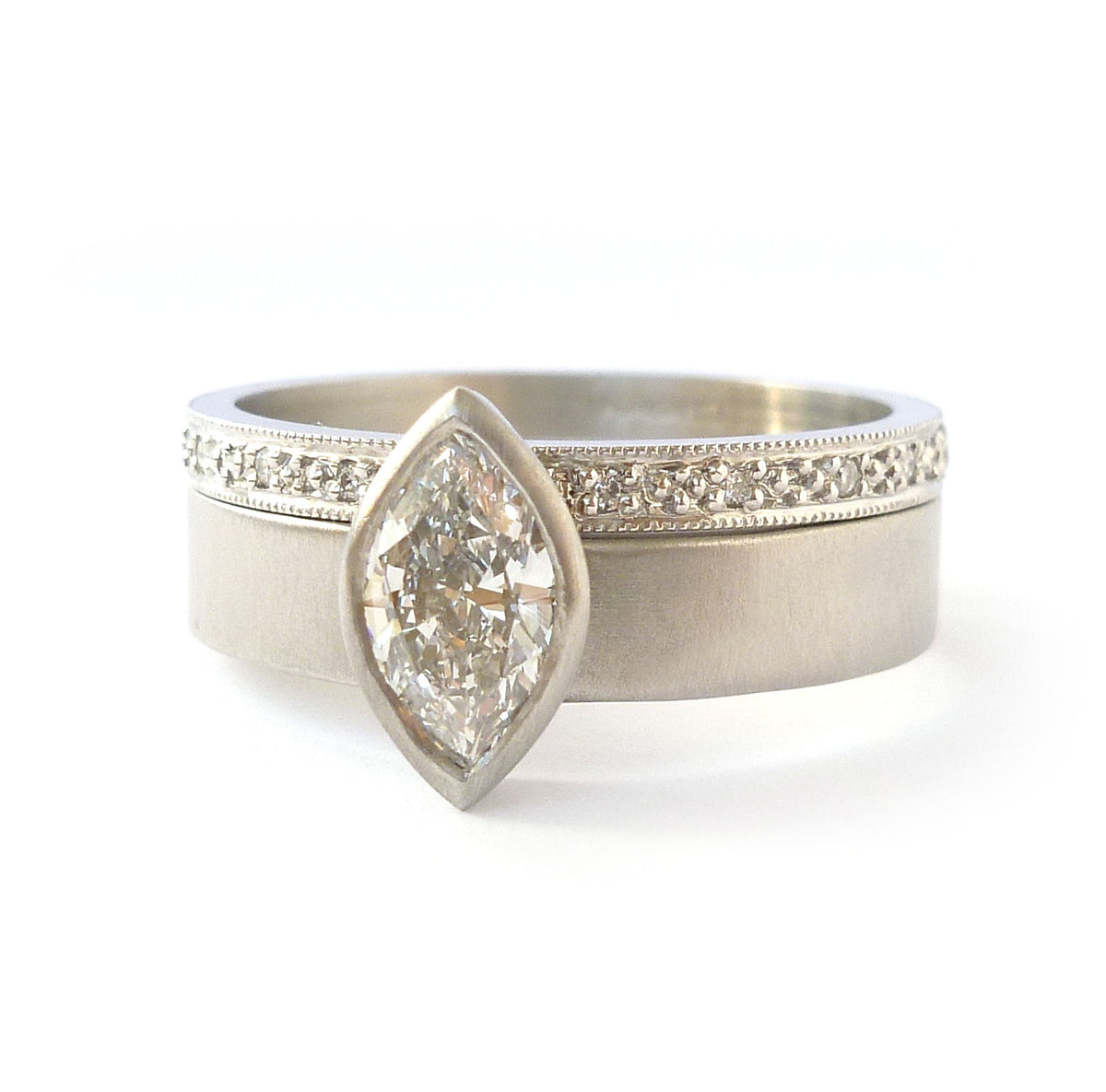 Contemporary, unique, bespoke and modern platinum marquise diamond engagement / wedding ring, eternity ring, matt brushed finish. Handmade by Sue Lane in Herefordshire, UK