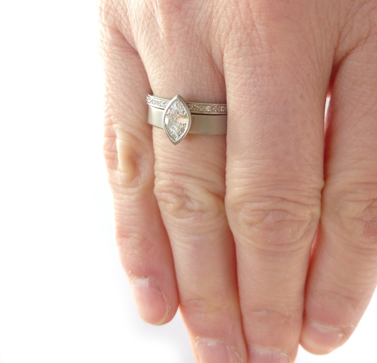Contemporary, unique, bespoke and modern platinum marquise diamond engagement / wedding ring, eternity ring, matt brushed finish. Handmade by Sue Lane in Herefordshire, UK