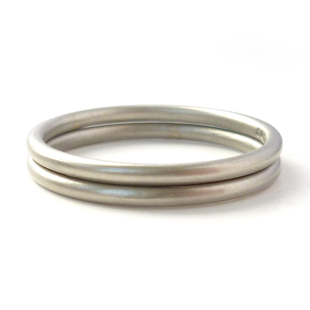 Modern delicate round section  halo wedding ring handmade by Sue Lane UK