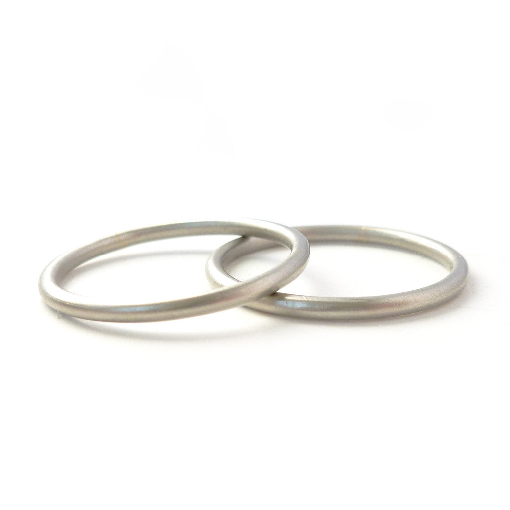 Modern delicate round section  halo wedding ring handmade by Sue Lane UK
