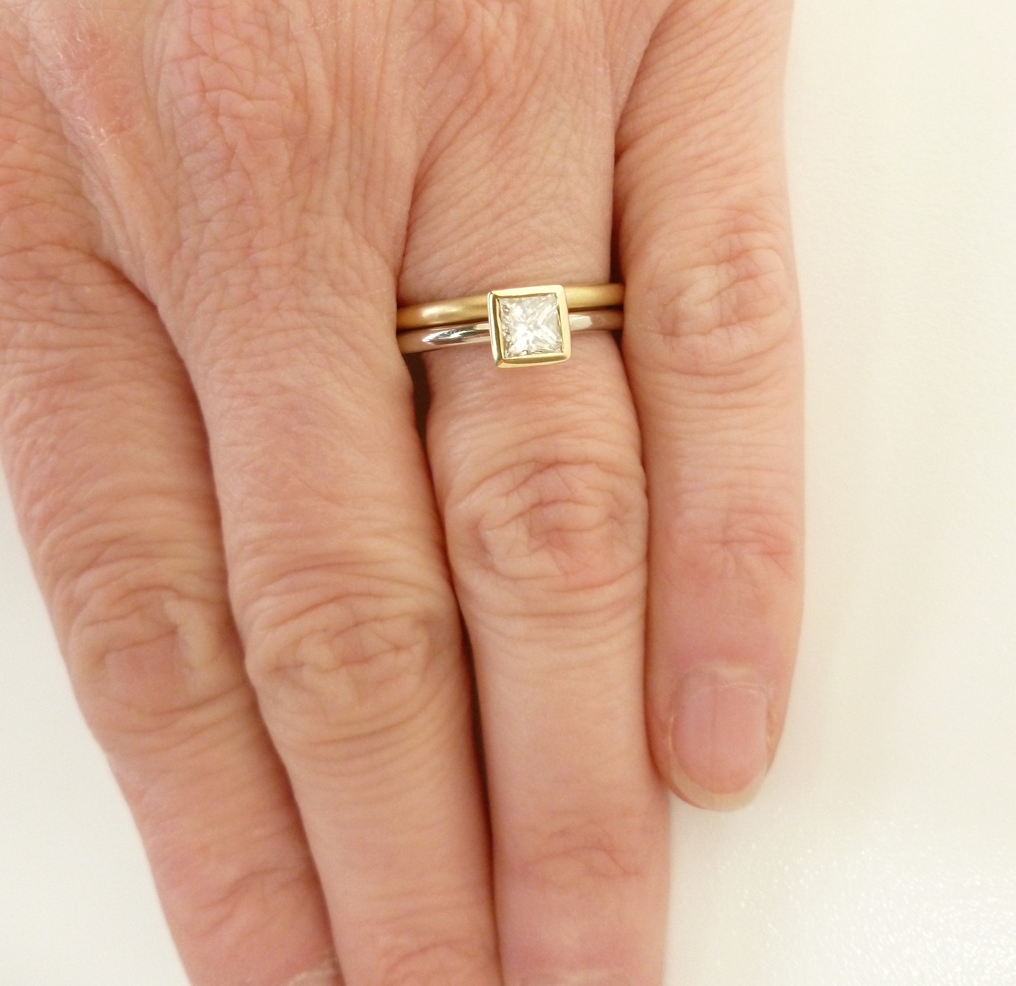 Contemporary, bespoke and modern 18k yellow gold square princess diamond engagement ring, commitment ring, matt brushed finish. Handmade by Sue Lane in Herefordshire, UK