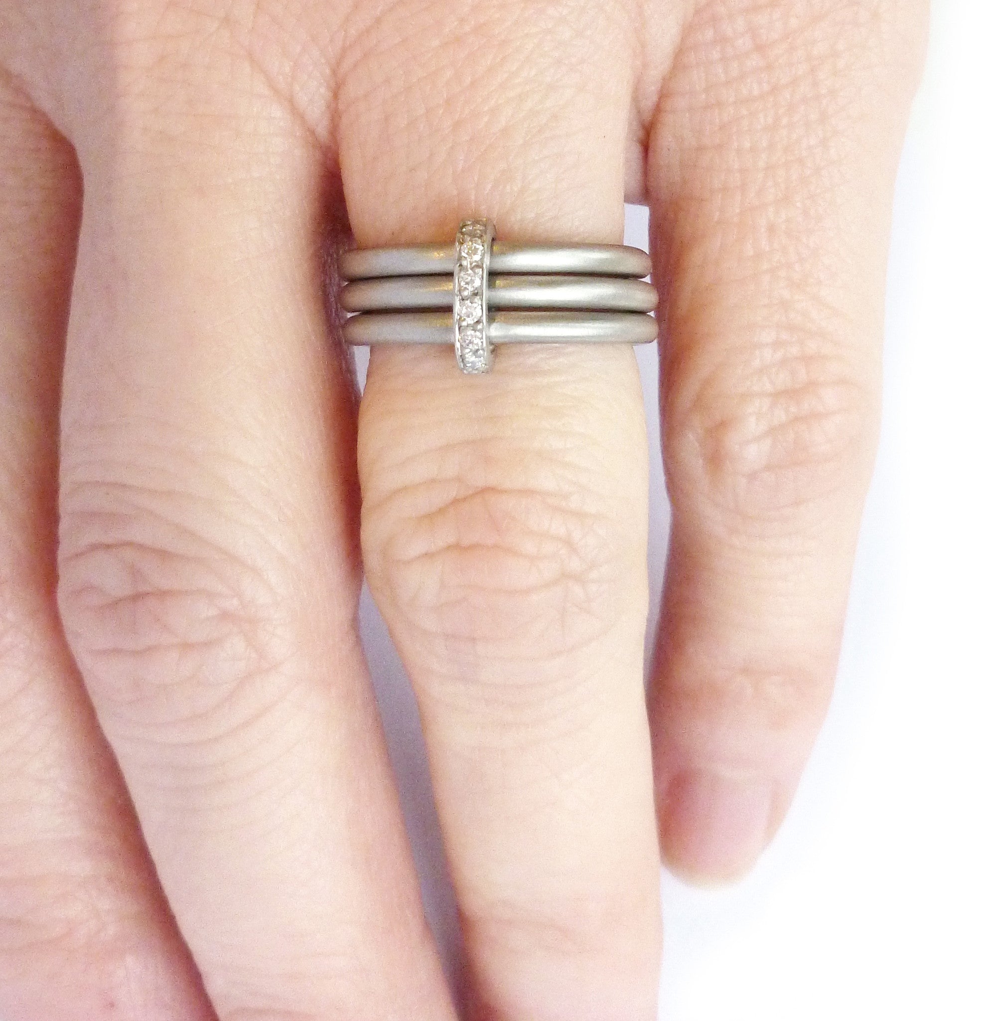 Unusual, unique, bespoke and modern platinum and diamond wedding ring, contemporary eternity ring, engagement ring, Handmade by Sue Lane in Herefordshire, UK. Multi band ring or interlocking ring, sometimes called triple band rings too.