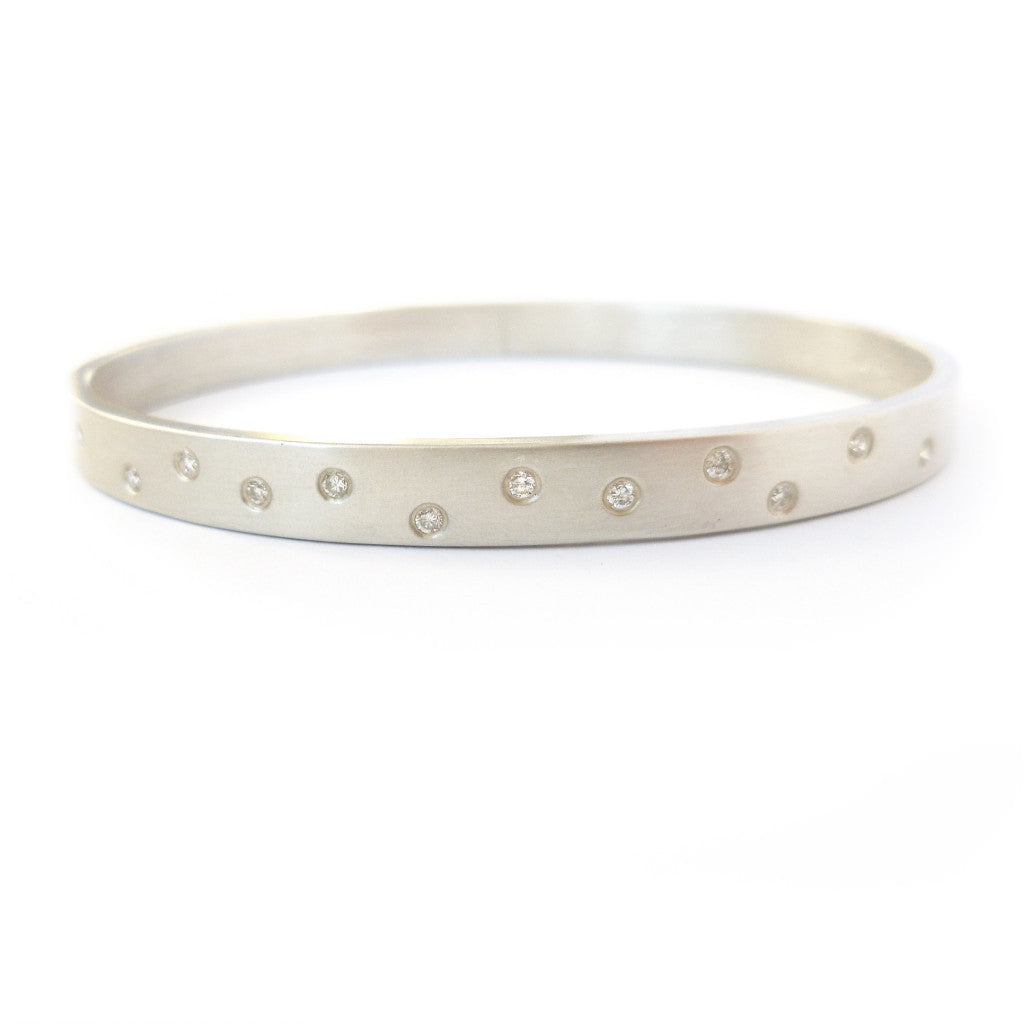 Contemporary, unique, bespoke and modern silver and diamond bangle with a matt brushed finish. Handmade by Sue Lane in Herefordshire, UK