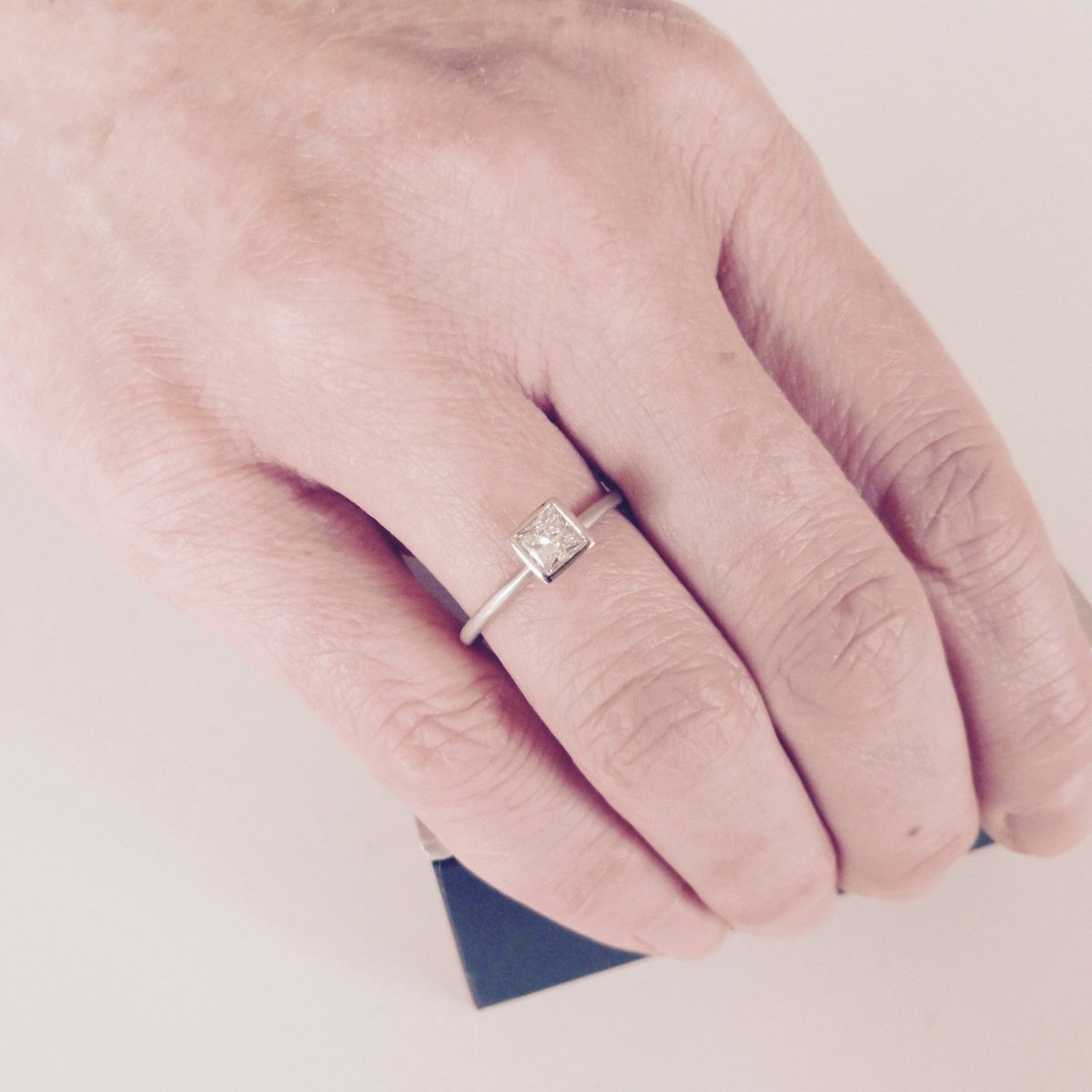 Platinum and square diamond engagement ring