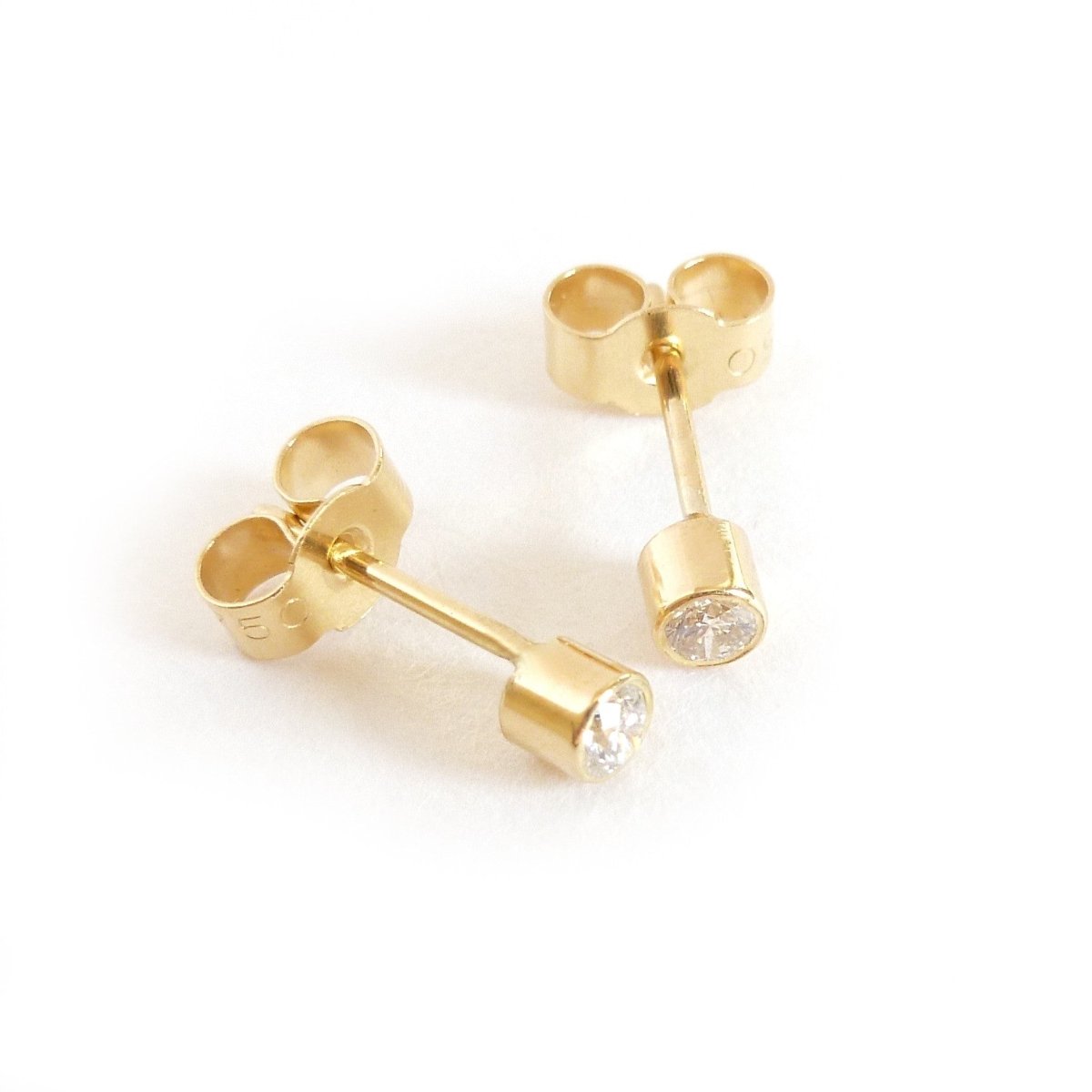 Modern, unique, bespoke, contemporary gold earrings by Sue Lane