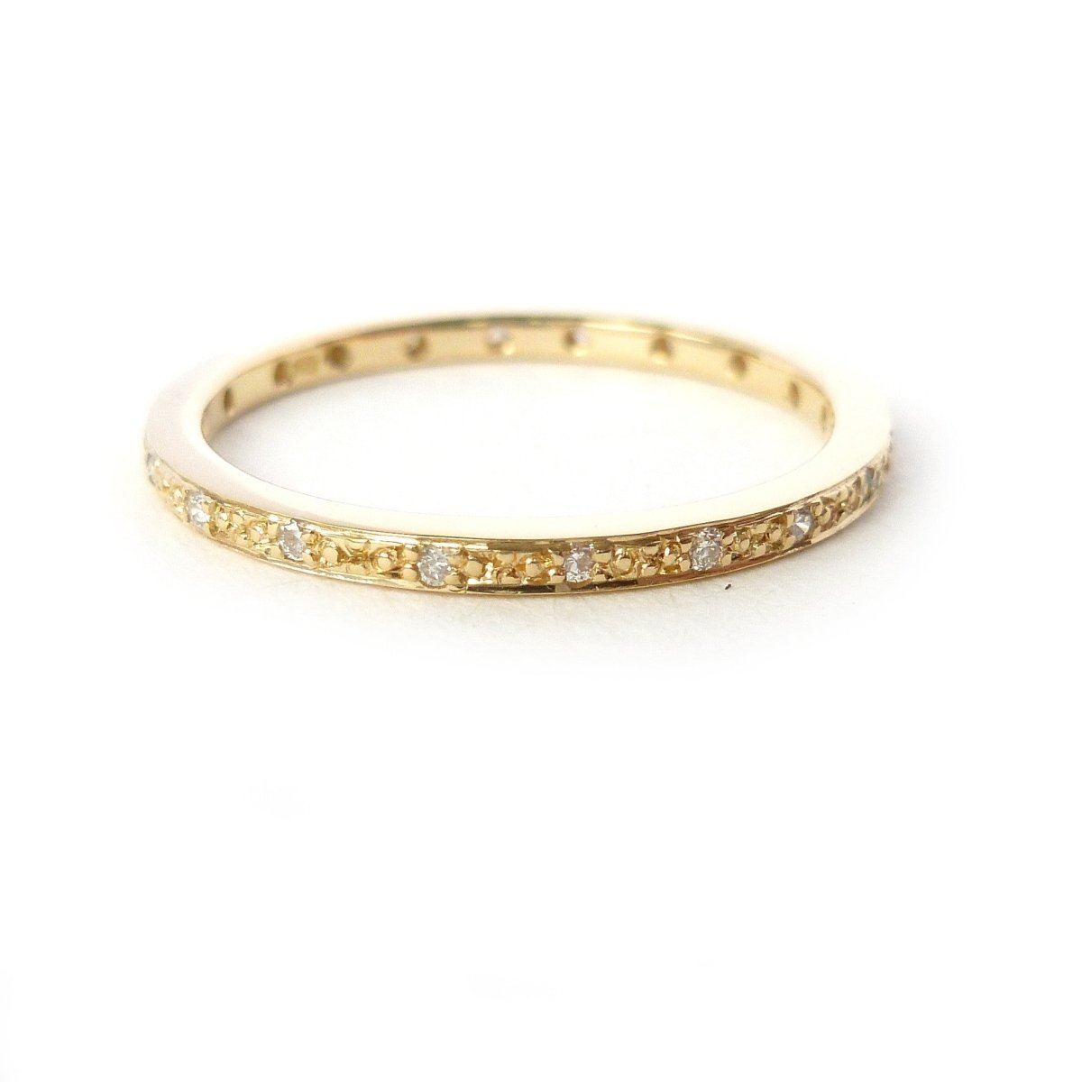 modern gold and pave diamond eternity ring made by designer maker sue lane UK