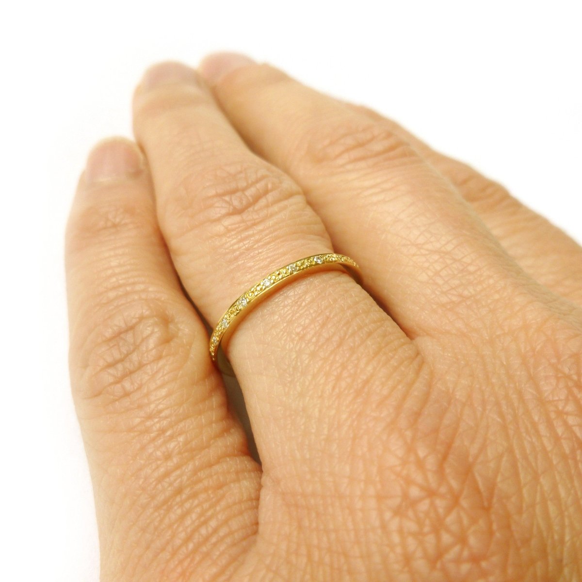 modern gold and pave diamond eternity ring made by designer maker sue lane UK