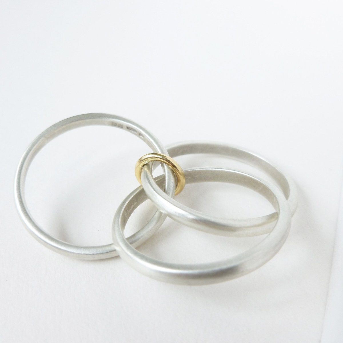 Unusual, unique, bespoke and modern silver "Russian Wedding ring" playful and tactile with brushed finish. Handmade by Sue Lane Contemporary Jewellery UK. 