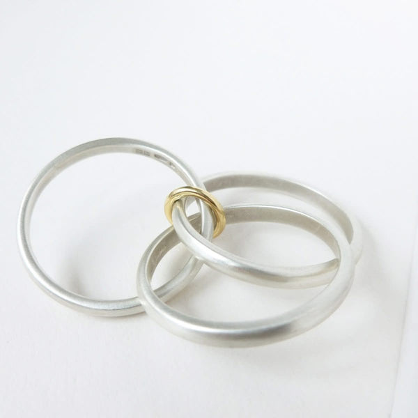 Unusual, unique, bespoke and modern silver "Russian Wedding ring" playful and tactile with brushed finish. Handmade by Sue Lane Contemporary Jewellery UK. 