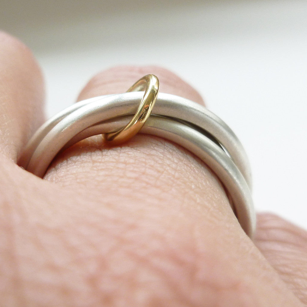 Unusual, unique, bespoke and modern silver "Russian Wedding ring" playful and tactile with brushed finish. Handmade by Sue Lane Contemporary Jewellery UK. 