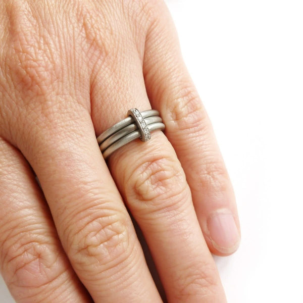 Unusual, unique, bespoke and modern platinum and diamond wedding ring, contemporary eternity ring, engagement ring. Multi band ring or interlocking ring, sometimes called triple band rings too.