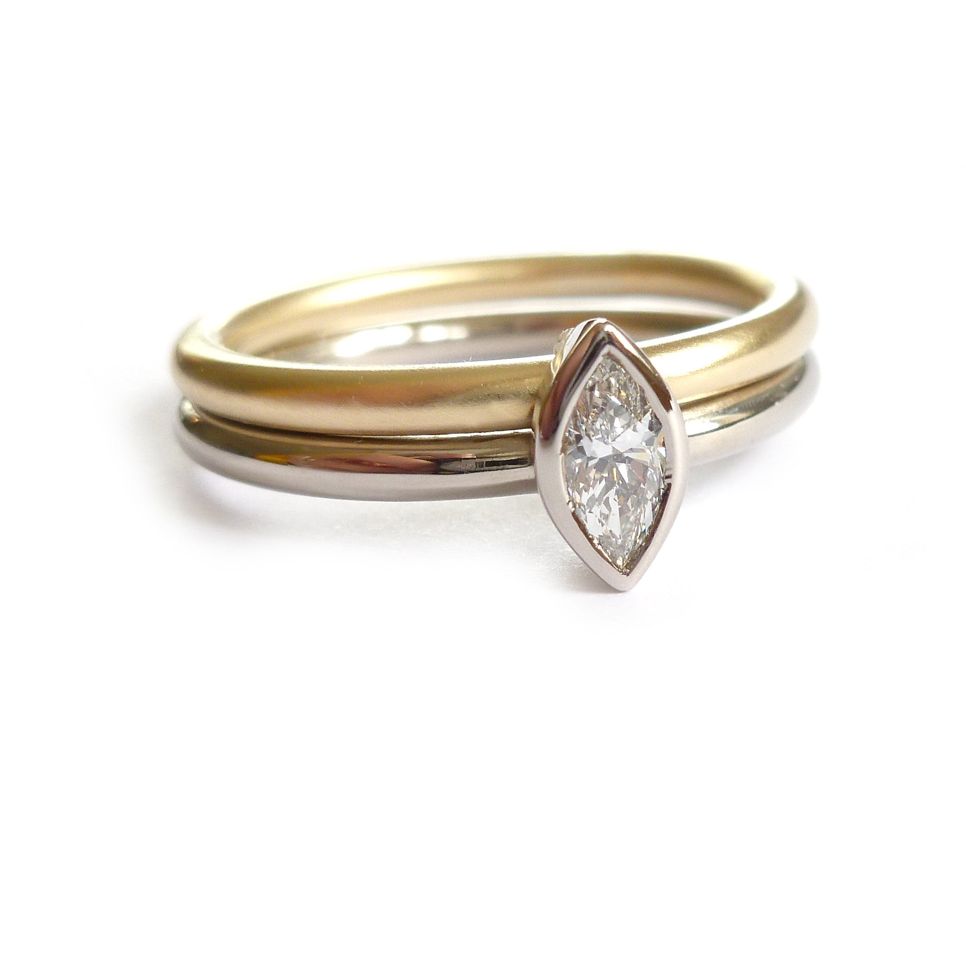 Two linking rings joined together making a special engagement ring. Multi band ring or interlocking ring, sometimes called double band ring too. Contemporary and bespoke. 