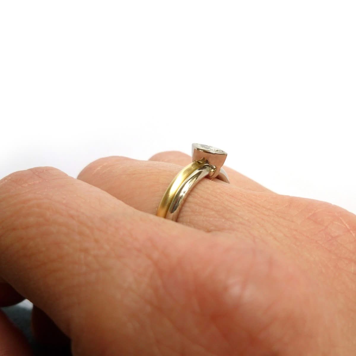 Two linking rings joined together making a special engagement ring. Multi band ring or interlocking ring, sometimes called double band ring too. Contemporary and bespoke. 