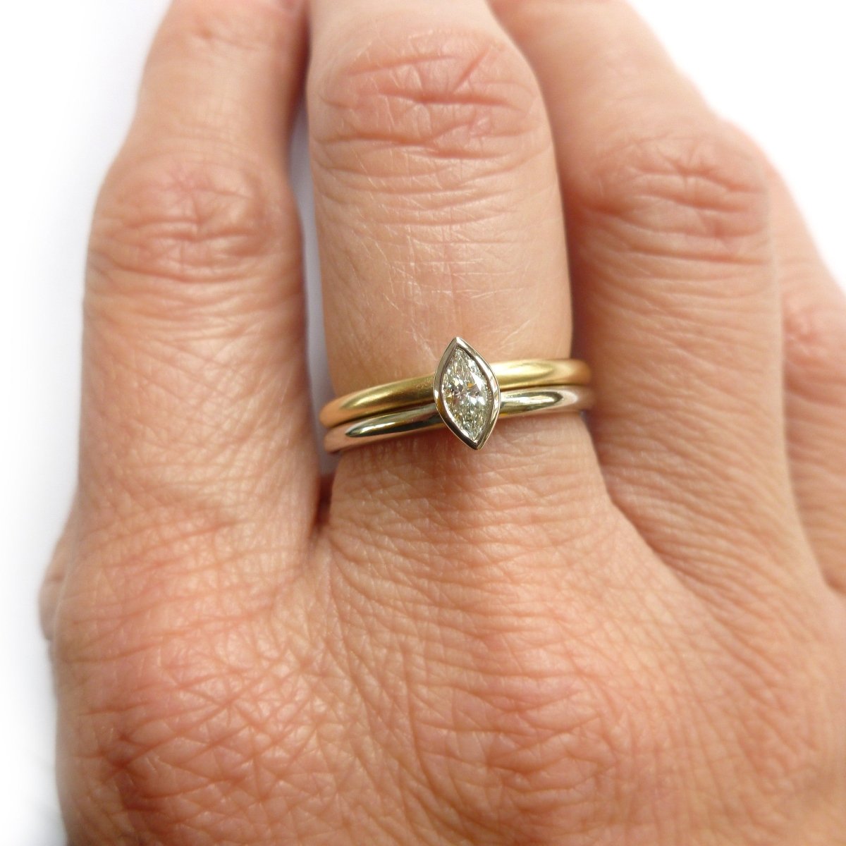 Two linking rings joined together making a special engagement ring. Multi band ring or interlocking ring, sometimes called double band ring too. Contemporary and bespoke. 